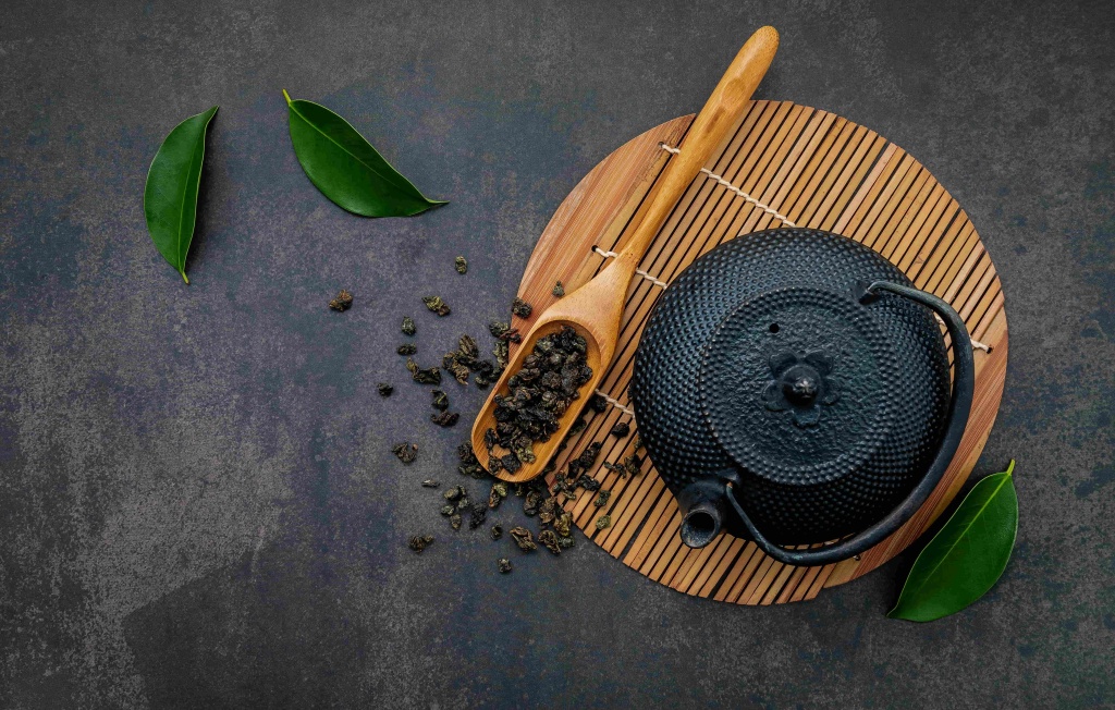 black-cast-iron-tea-pot-with-herbal-tea-set-up-dark-stone (1).jpg